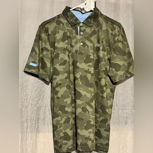 Good Good camo golf polo. It has blue golf flags